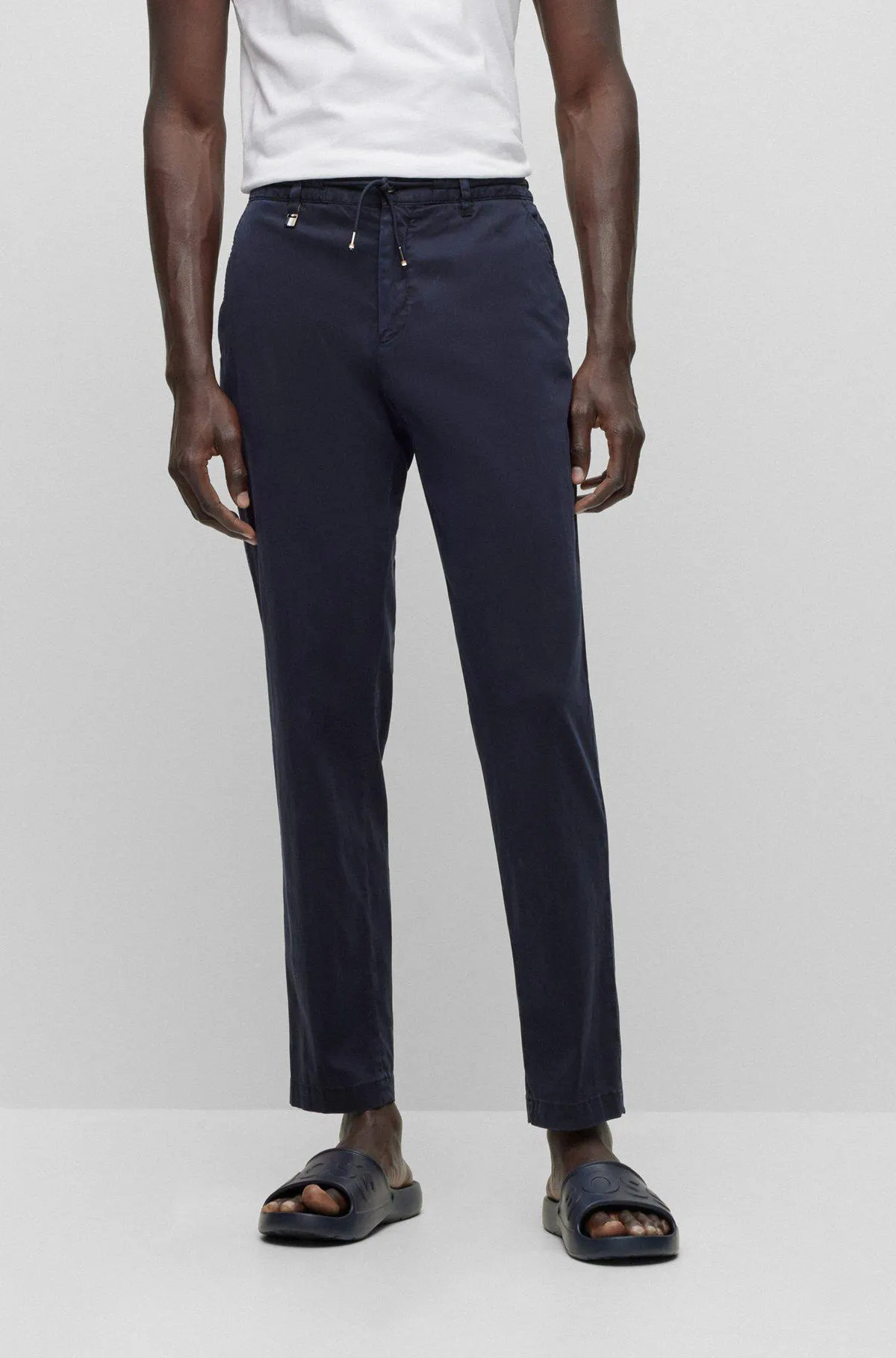 Slim-fit trousers with drawcord waist in stretch fabric