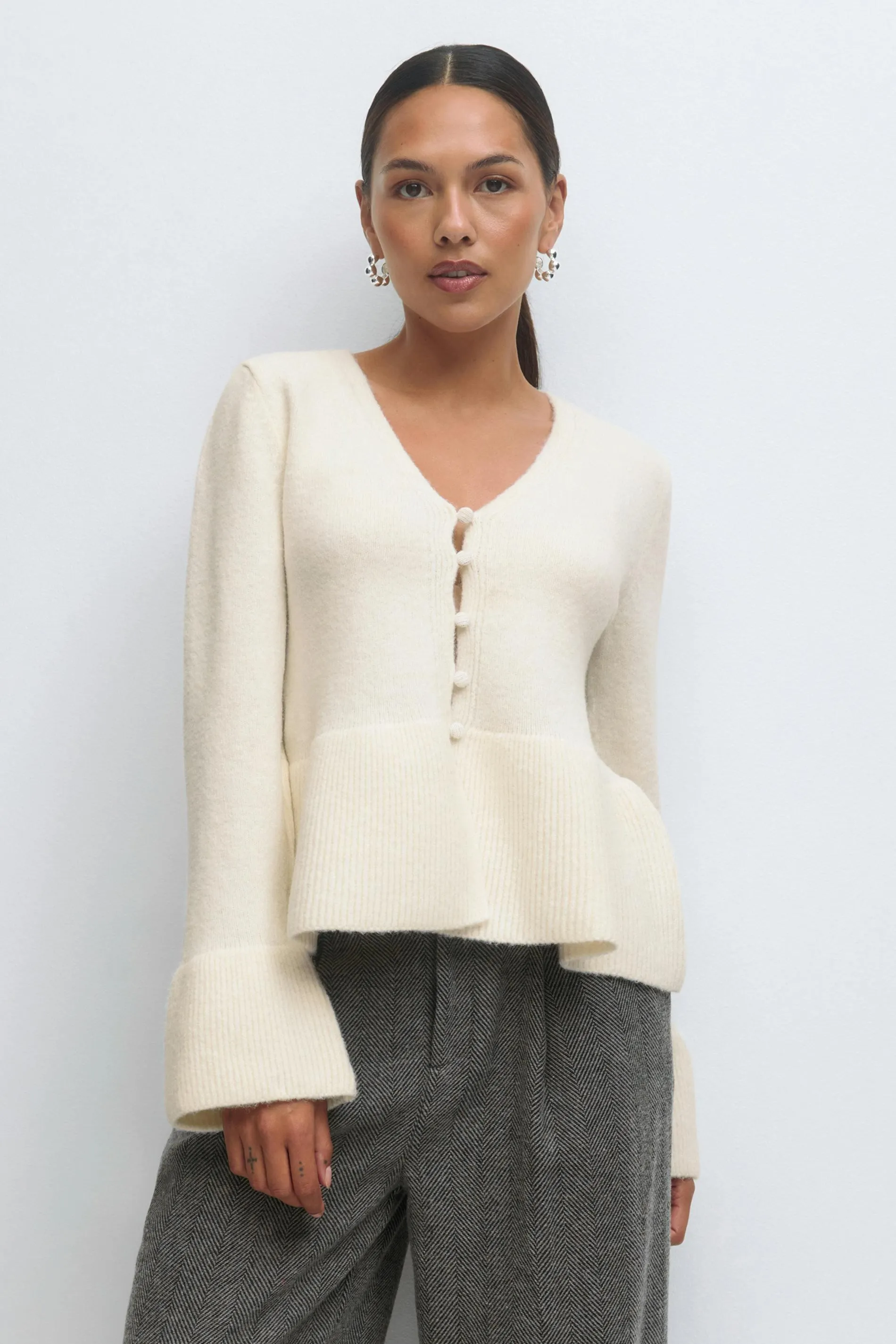 Knitted peplum cardigan