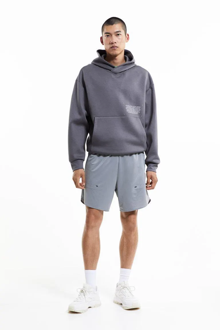 Treningsshorts i elastisk DryMove™ med lommer