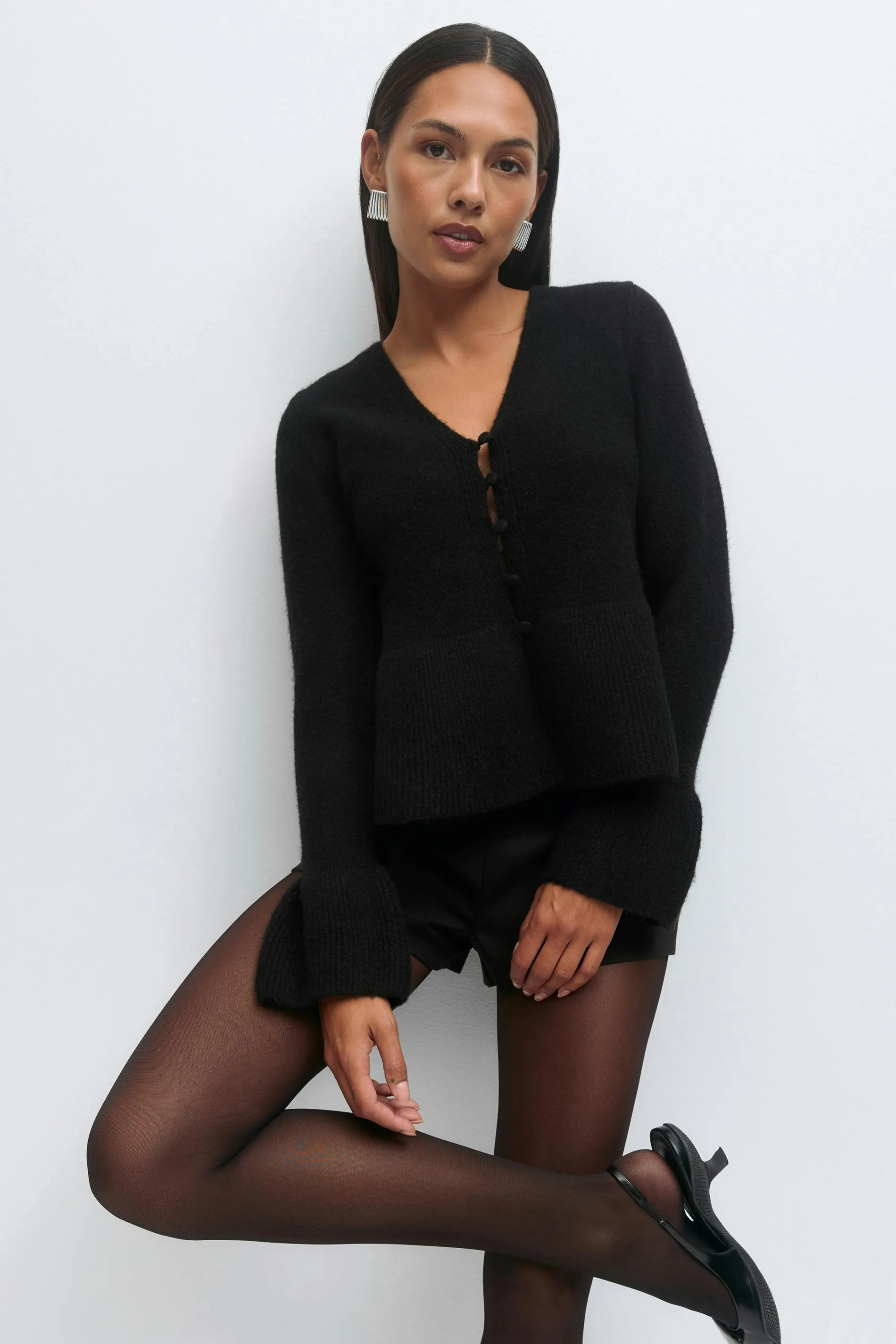 Knitted peplum cardigan