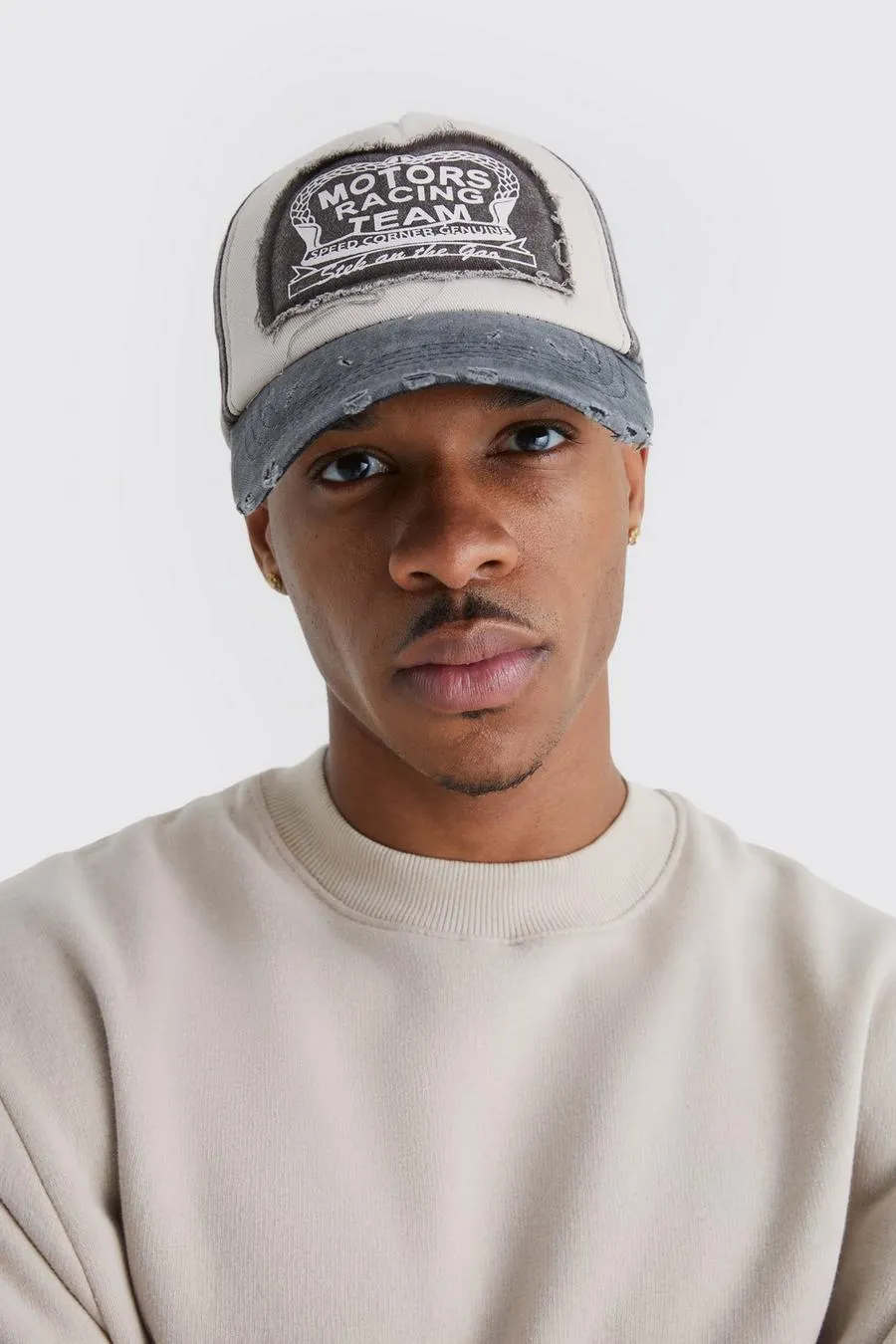 Moto Badge Distressed Trucker Cap