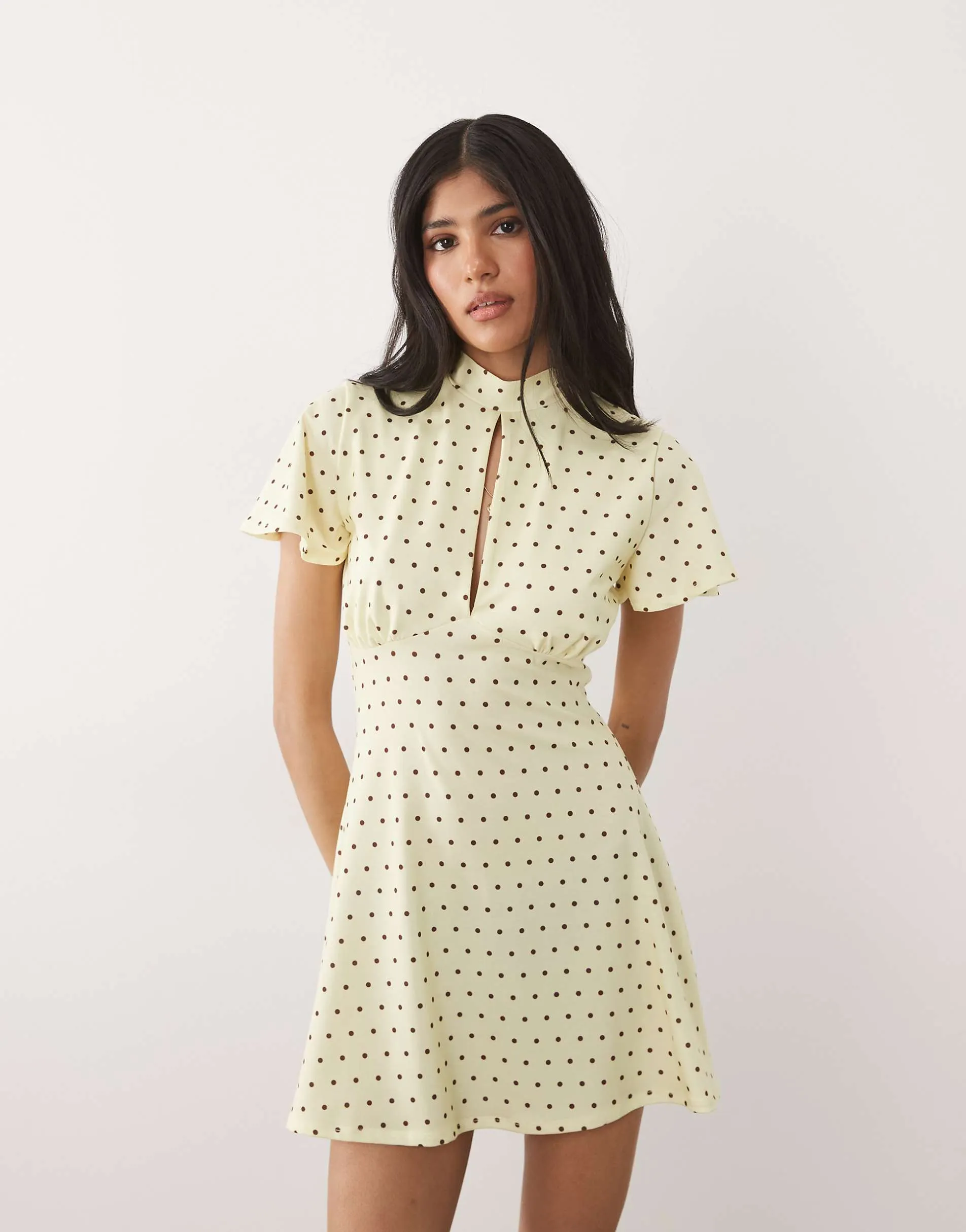 ASOS DESIGN cap sleeve with tie detail mini dress in buttermilk and brown polka dot print