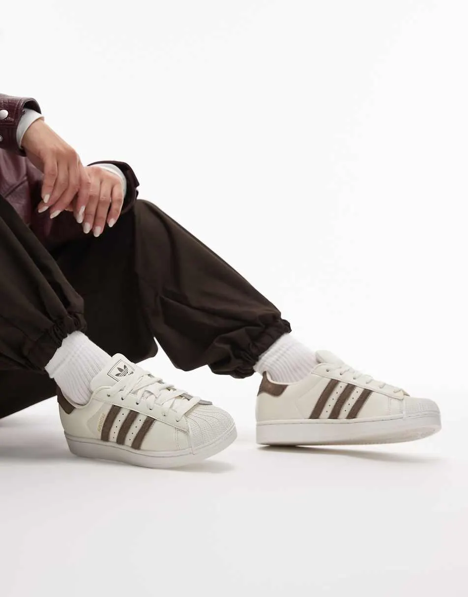 adidas Originals Superstar II trainers in white with pony hair stripes in brown