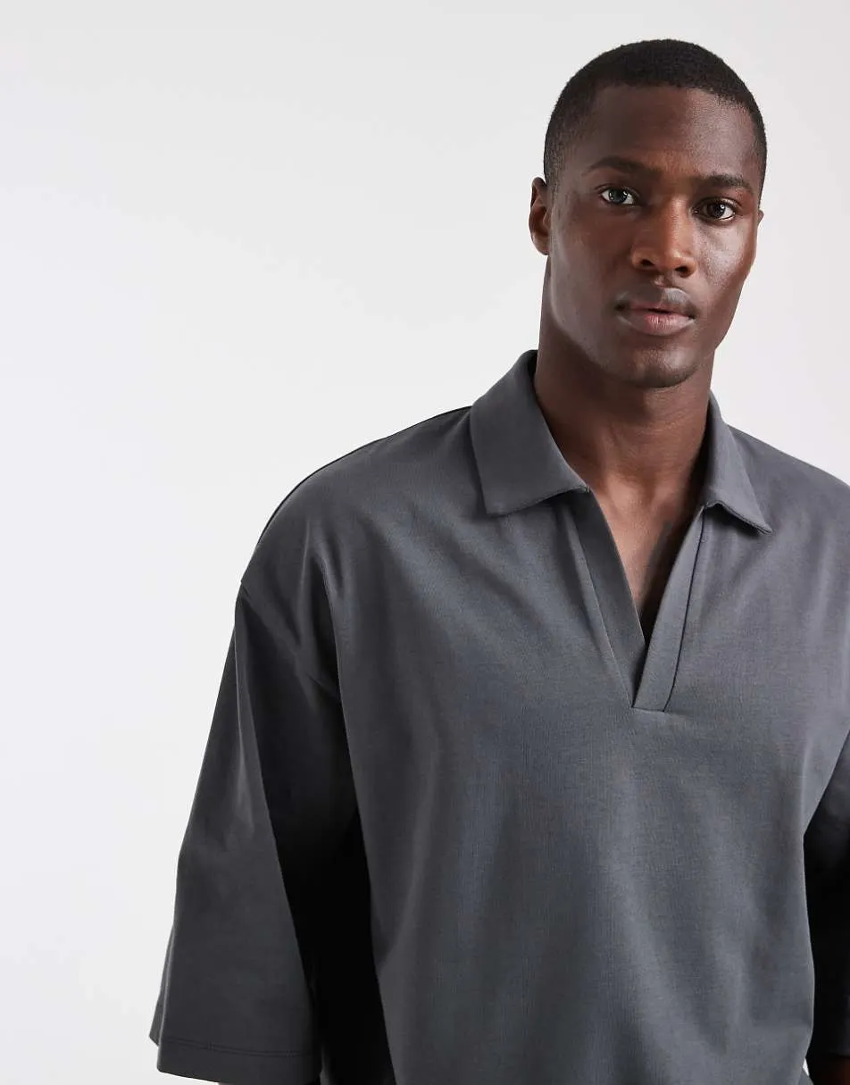 ASOS DESIGN heavyweight boxy oversized polo with half sleeve in charcoal