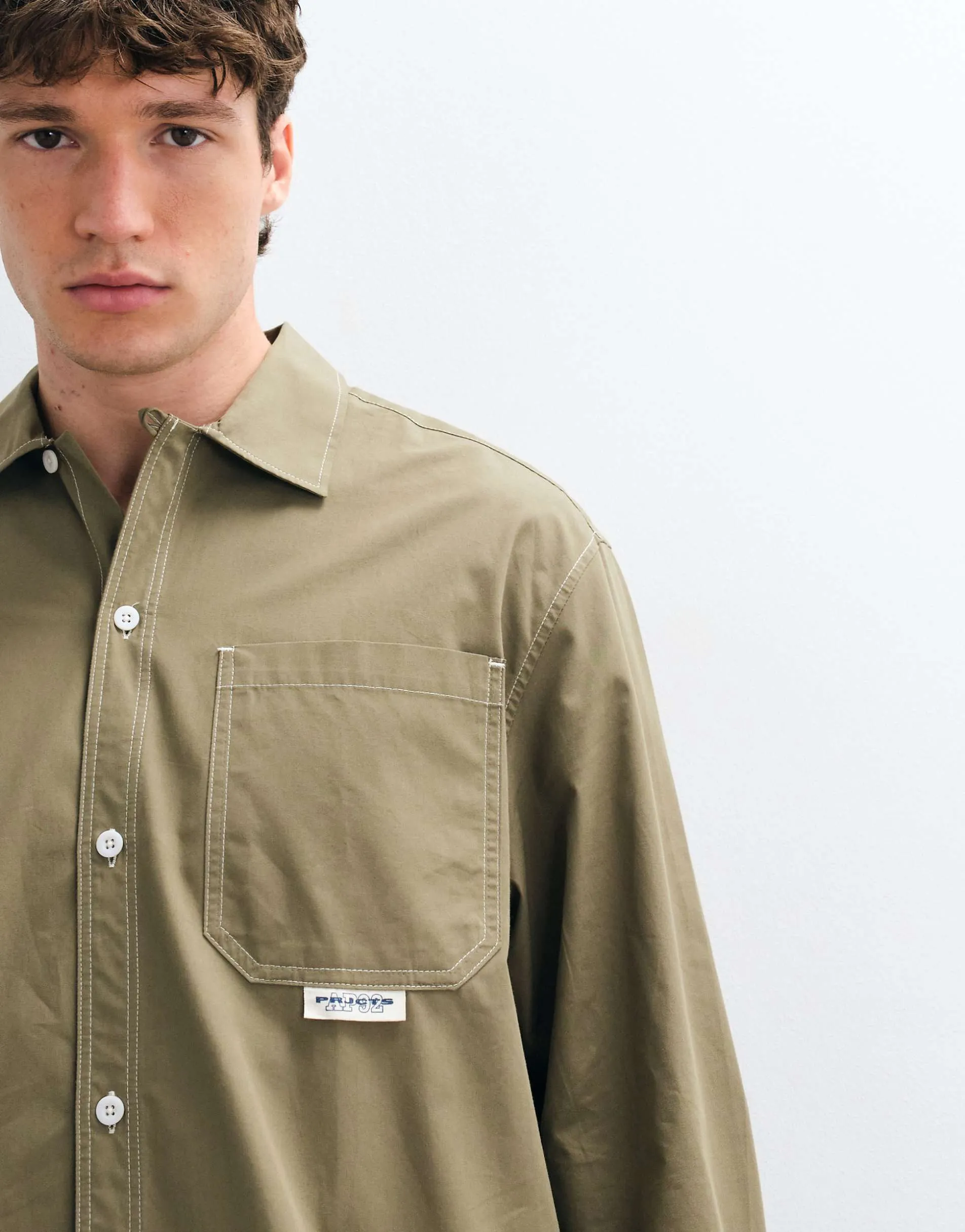 ASOS DESIGN boxy oversized shirt with chest badge in khaki