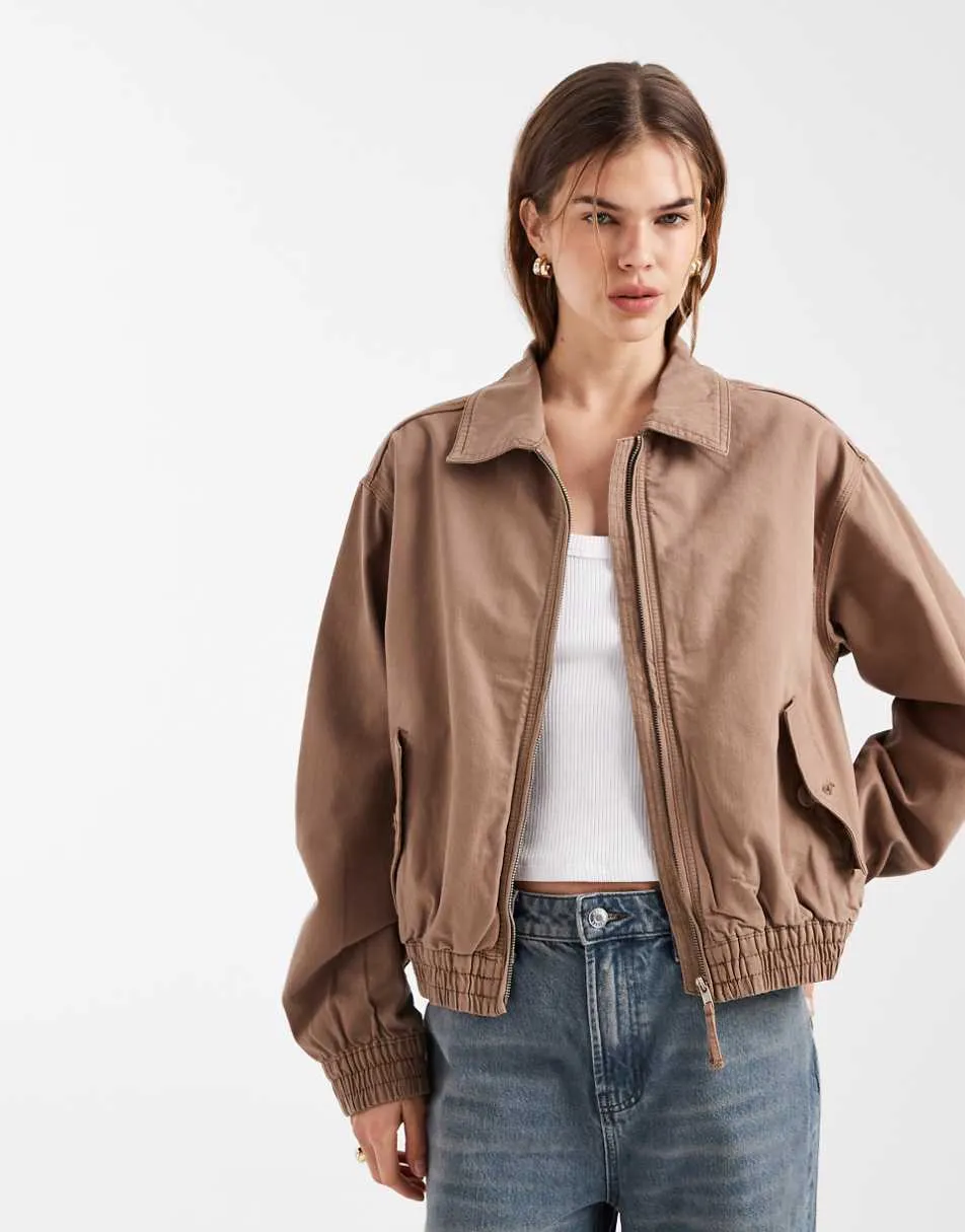 ASOS DESIGN washed cotton bomber jacket in brown