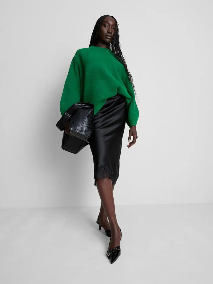 Jupe mi-longue en dentelle et satin