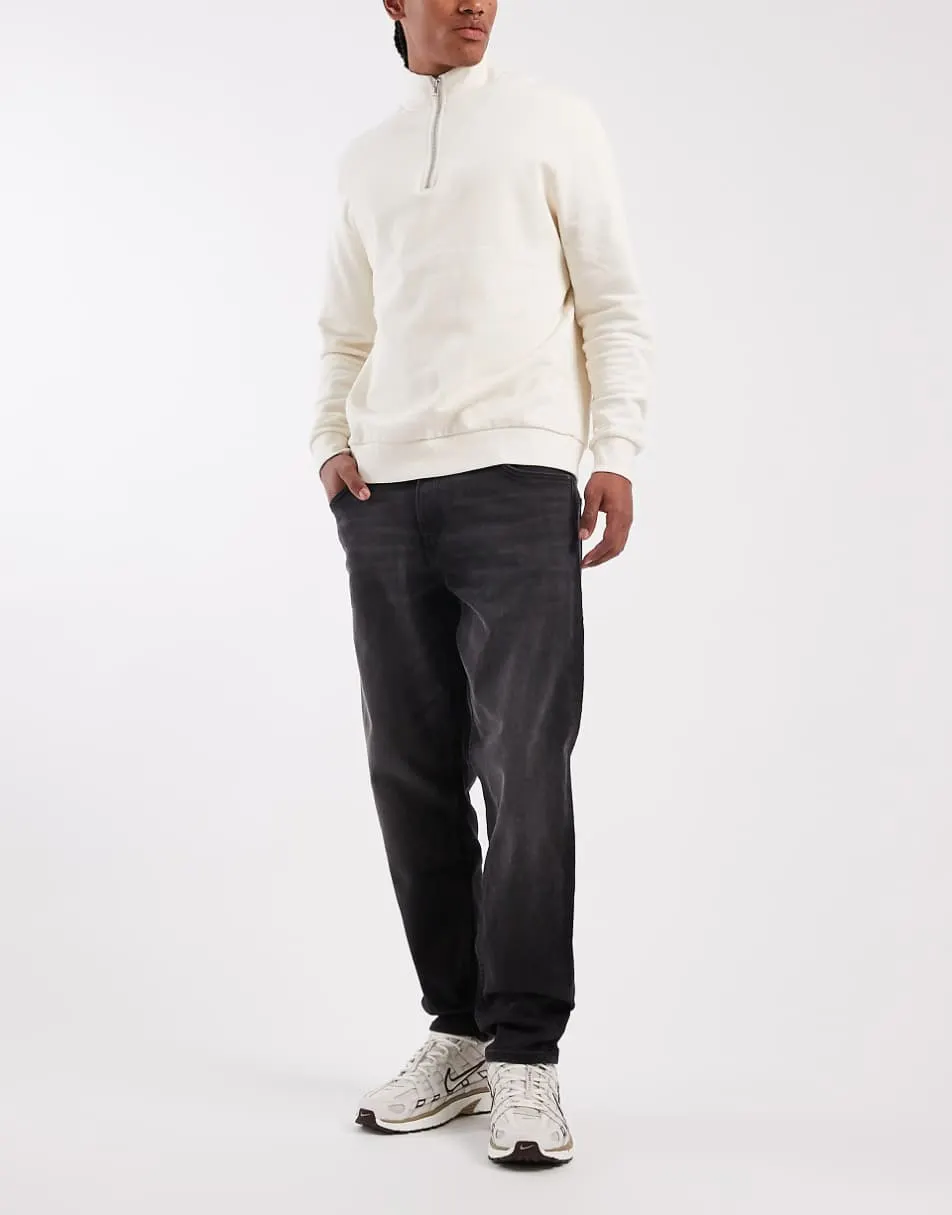 ASOS DESIGN tapered jeans in black wash with stretch