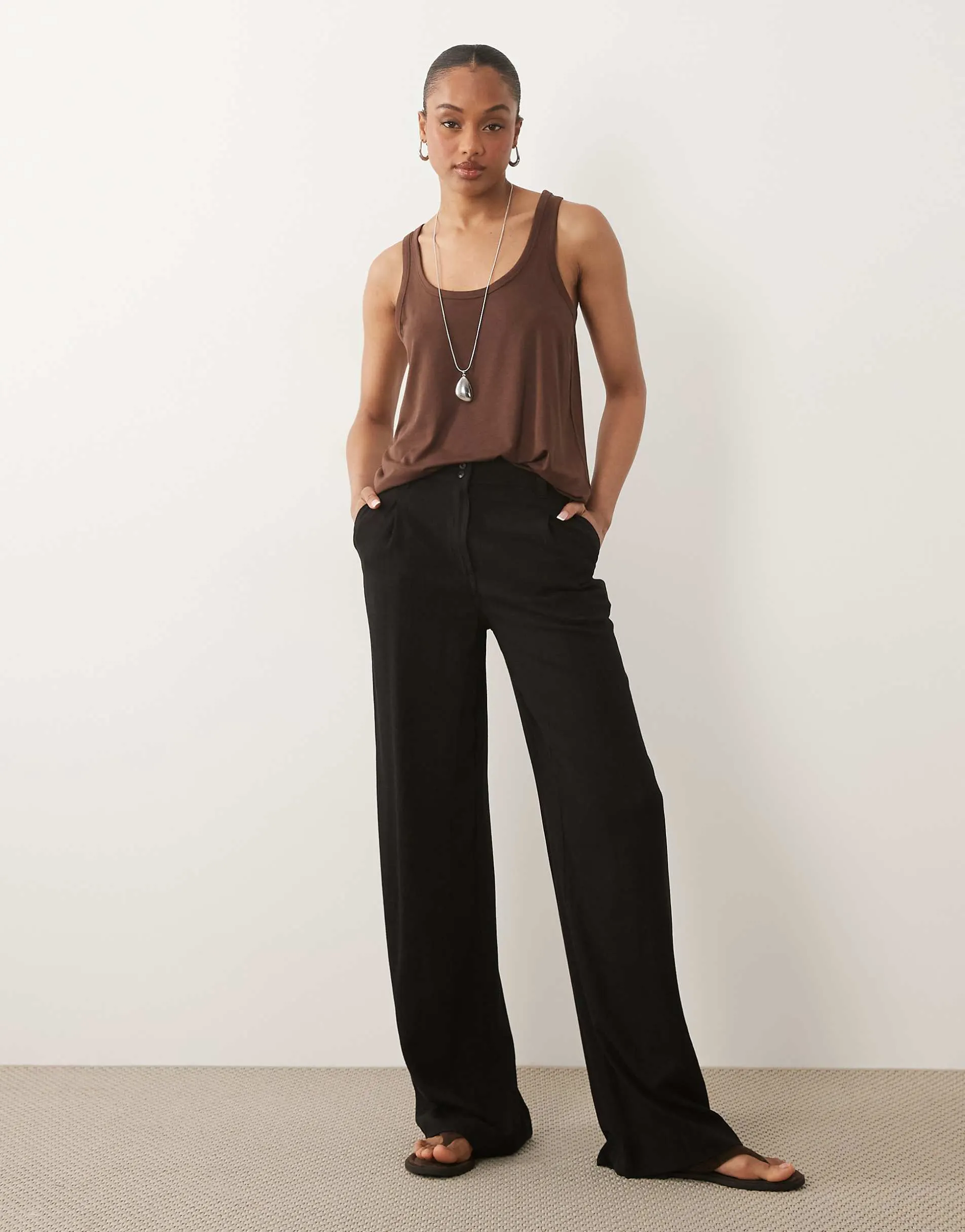 ASOS DESIGN Tall wide leg trousers with pleat detail in linen blend in black