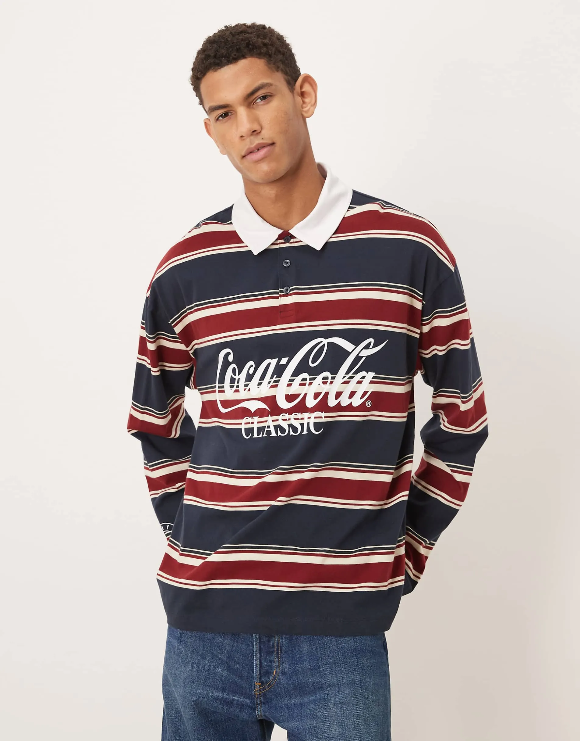 ASOS DESIGN relaxed polo with Coca Cola print in navy