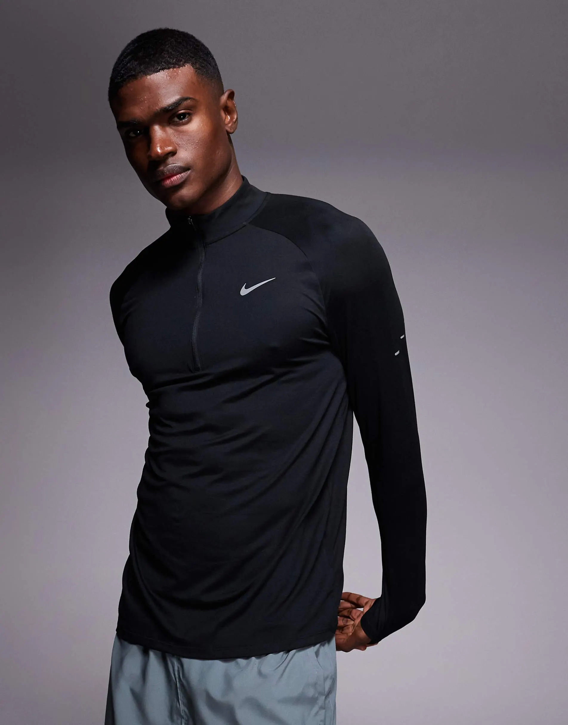 Nike Running Stride Dri-FIT half zip longsleeve top in black