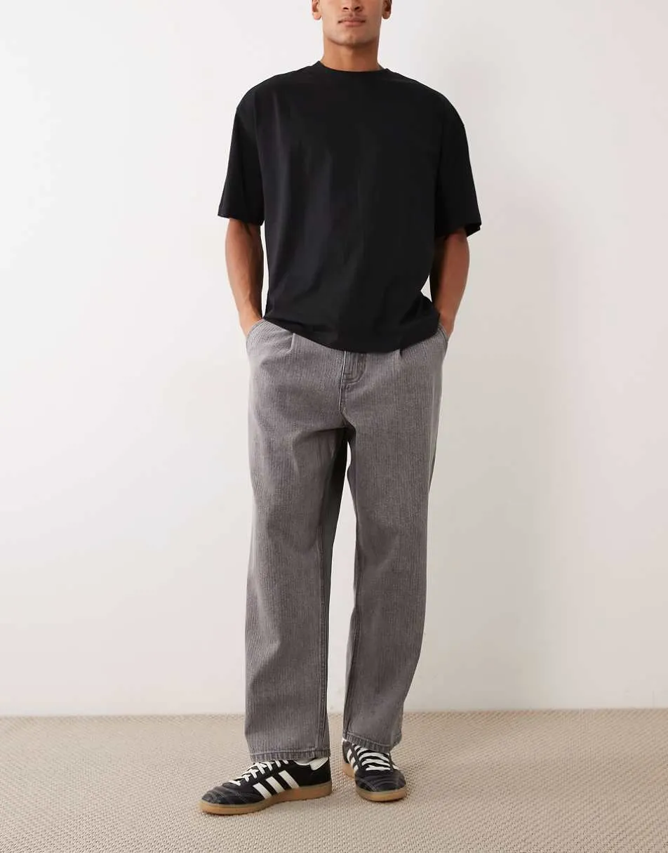 ASOS DESIGN relaxed tapered jeans in washed black with stripes