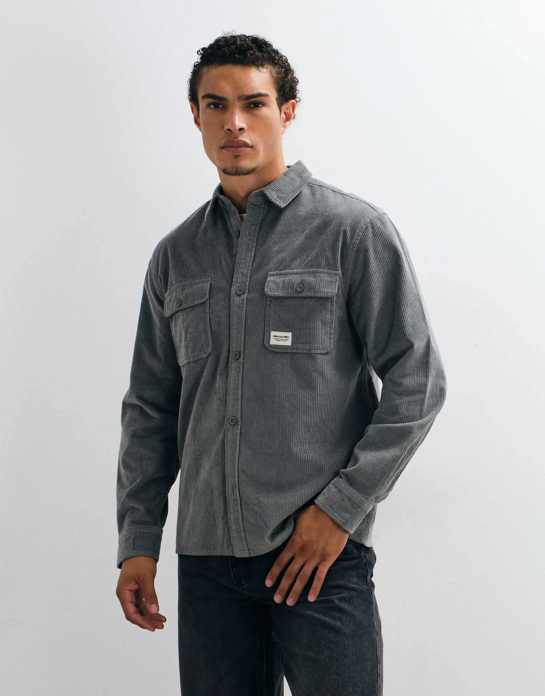 ASOS DESIGN cord overshirt with badge in stone blue