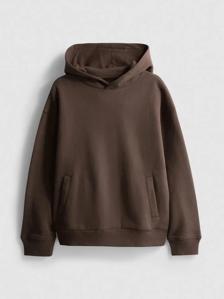 7–15 ans | Sweat à capuche en coton majoritaire