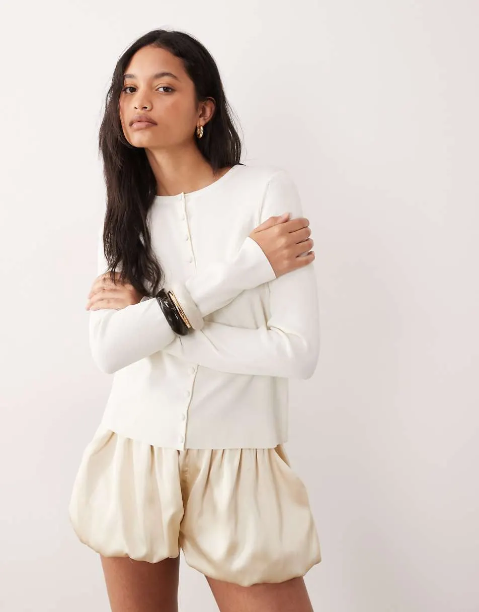 ASOS DESIGN compact crew neck cardigan with self covered buttons in cream