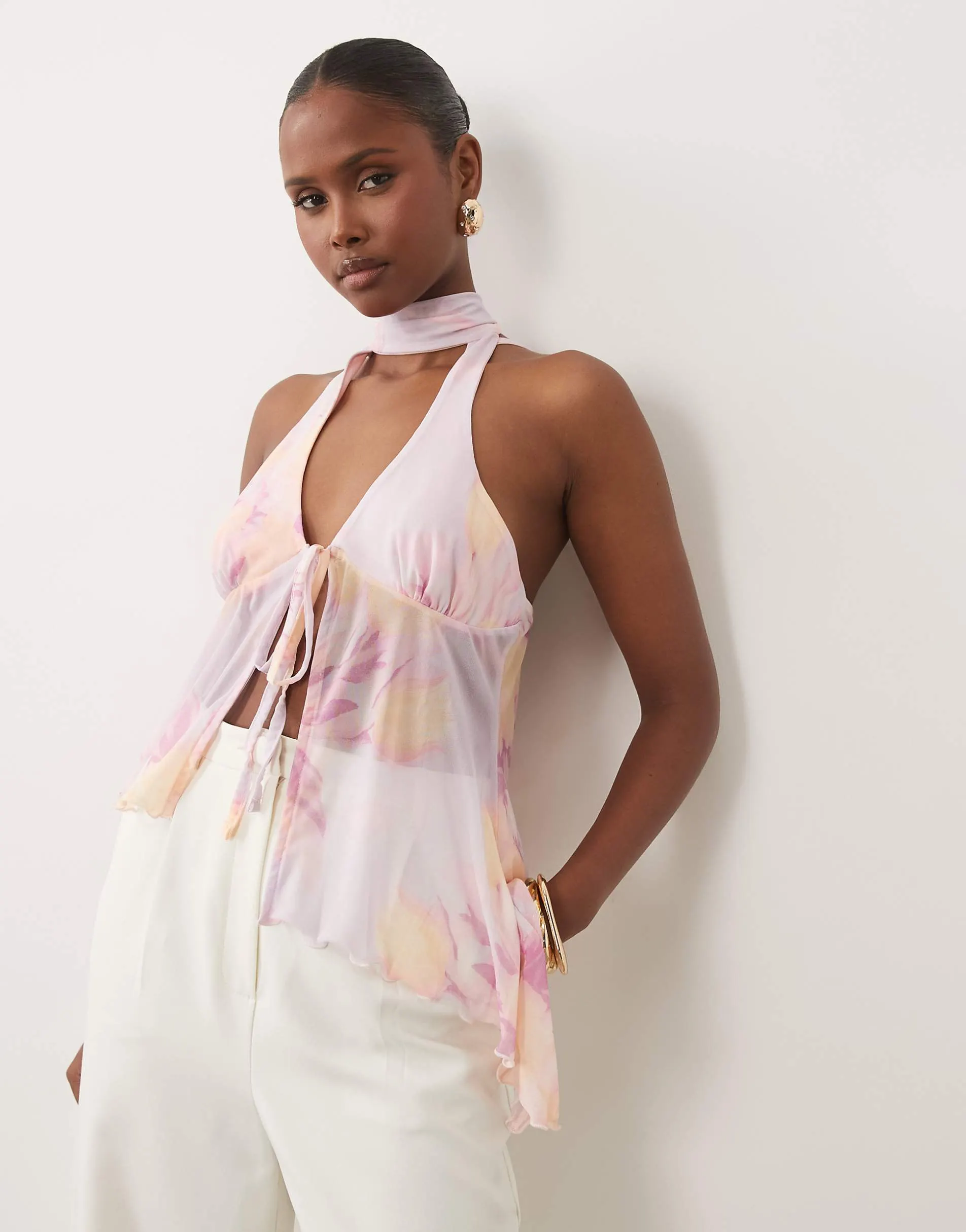 ASOS DESIGN printed mesh tie front asymmetric hem halter top in lilac floral print