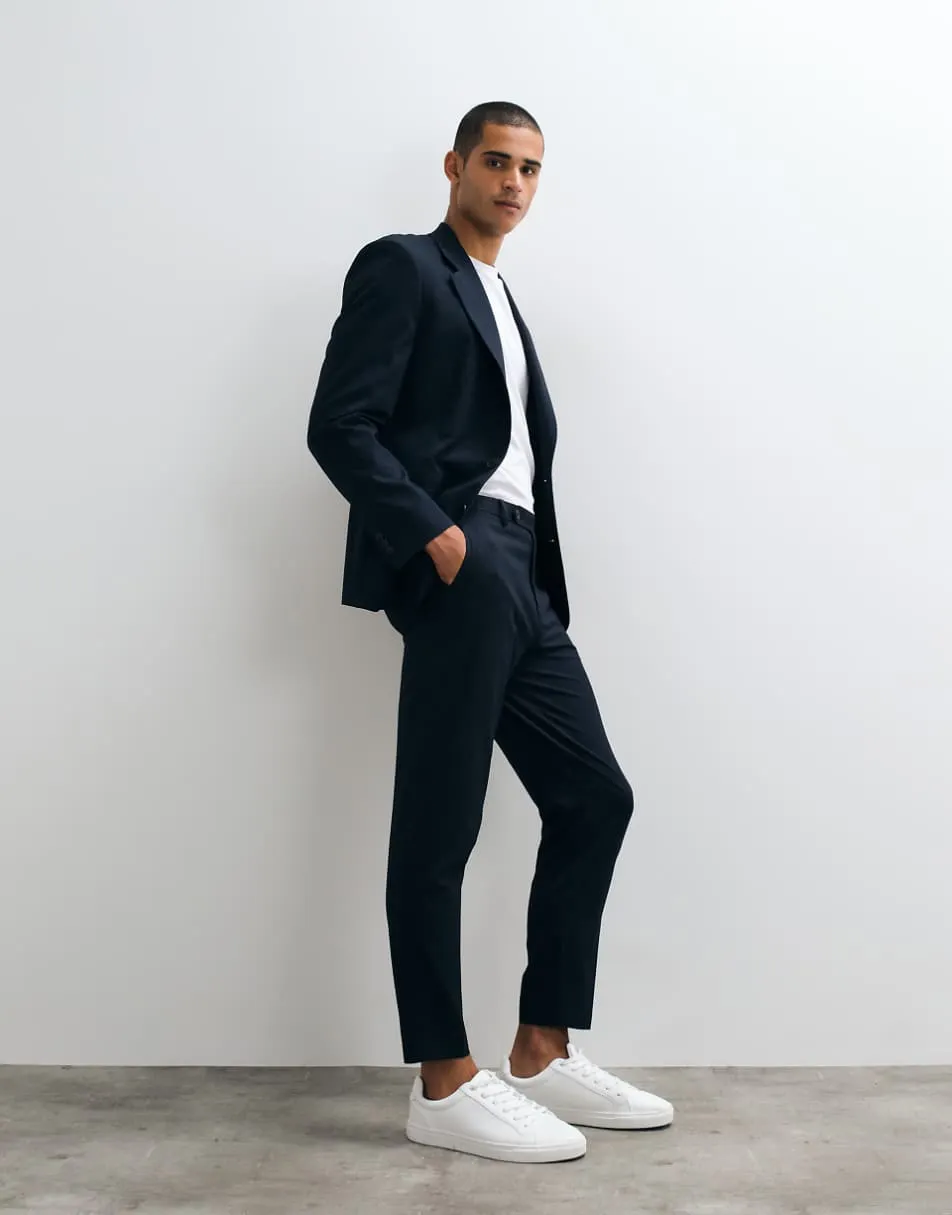 ASOS DESIGN tapered suit trousers in navy pinstripe