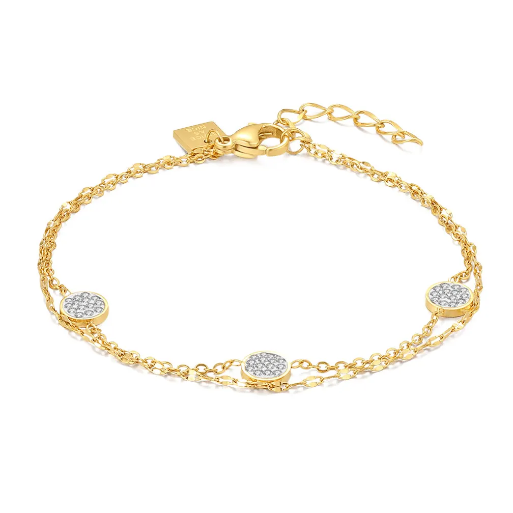 Armband in goudkleurig edelstaal, dubbele ketting, 3 rondjes met witte kristallen