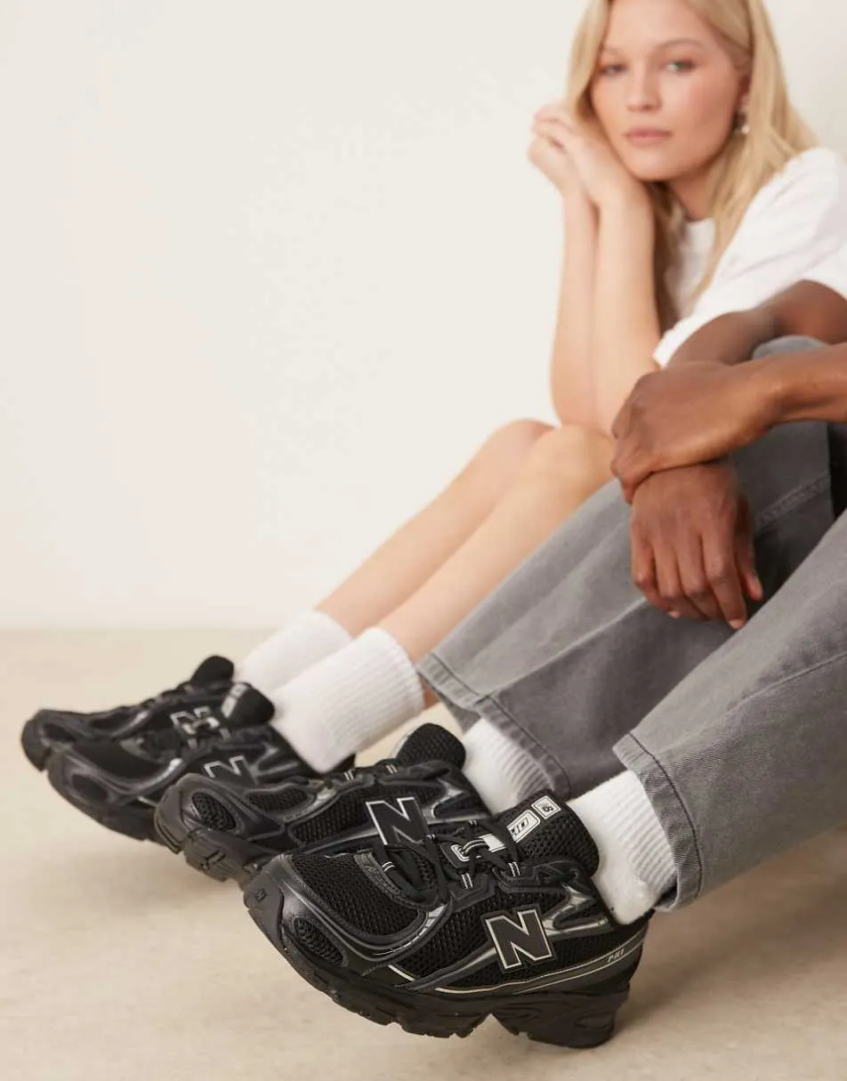 New Balance 740 trainers in black and silver metallic