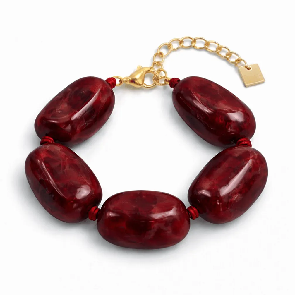 Armband in edelstaal, grote rode kralen