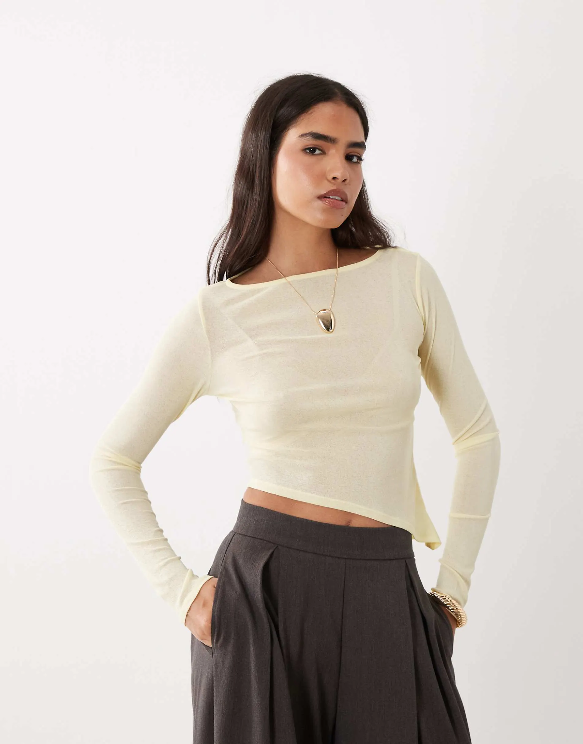 ASOS DESIGN sheer long sleeve top with asymmetric hem in buttermilk