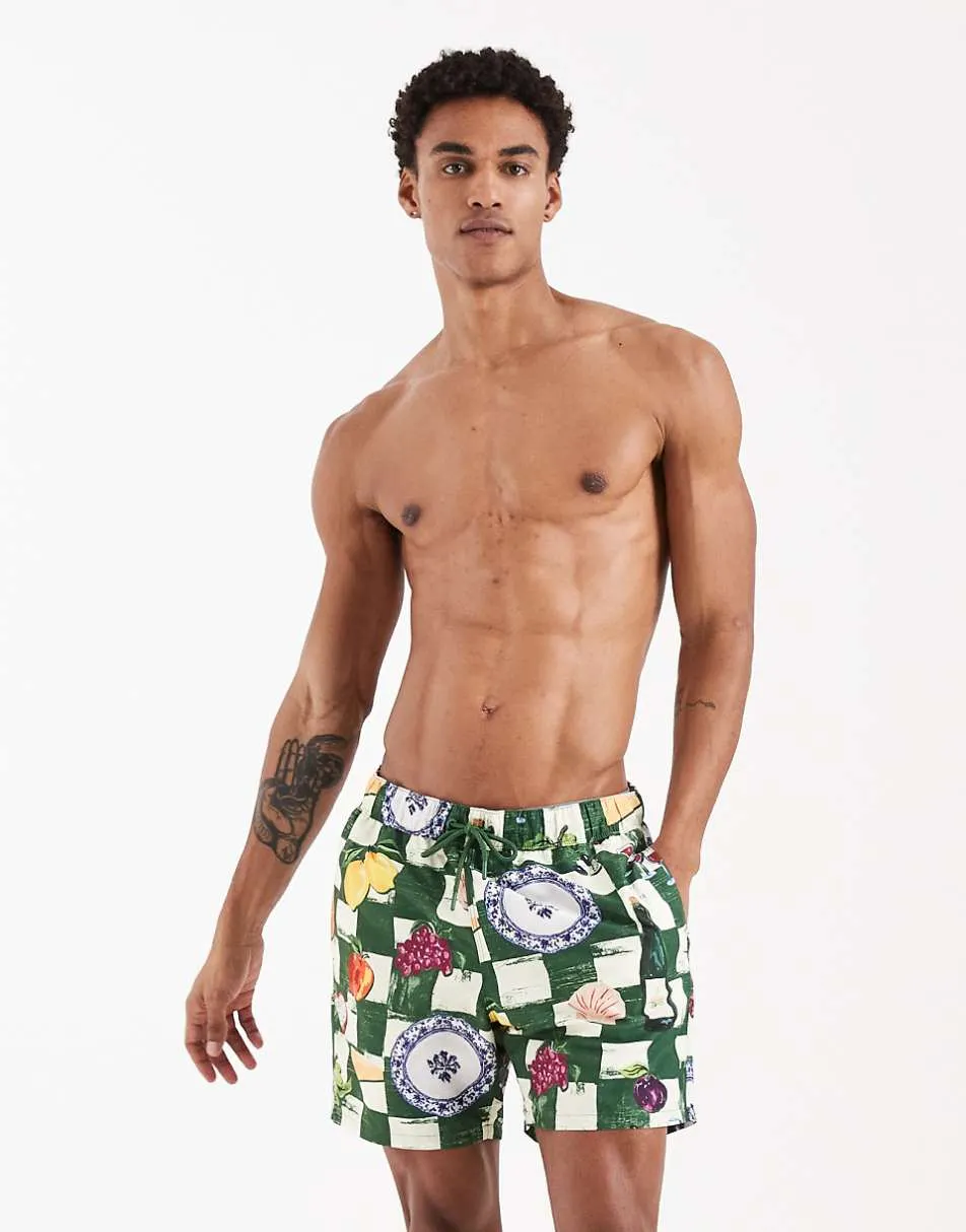 ASOS DESIGN mid length swim shorts in tile fruit print
