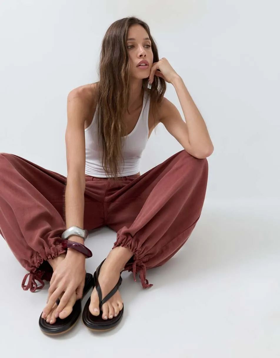 ASOS DESIGN balloon trouser with front pockets and adjustable tie hem in rust