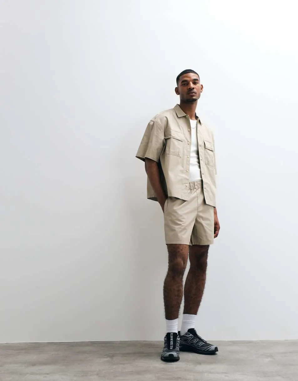 ASOS DESIGN co-ord cotton twill shorts in mid length in beige