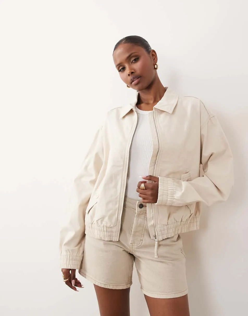 ASOS DESIGN washed cotton bomber jacket in cream