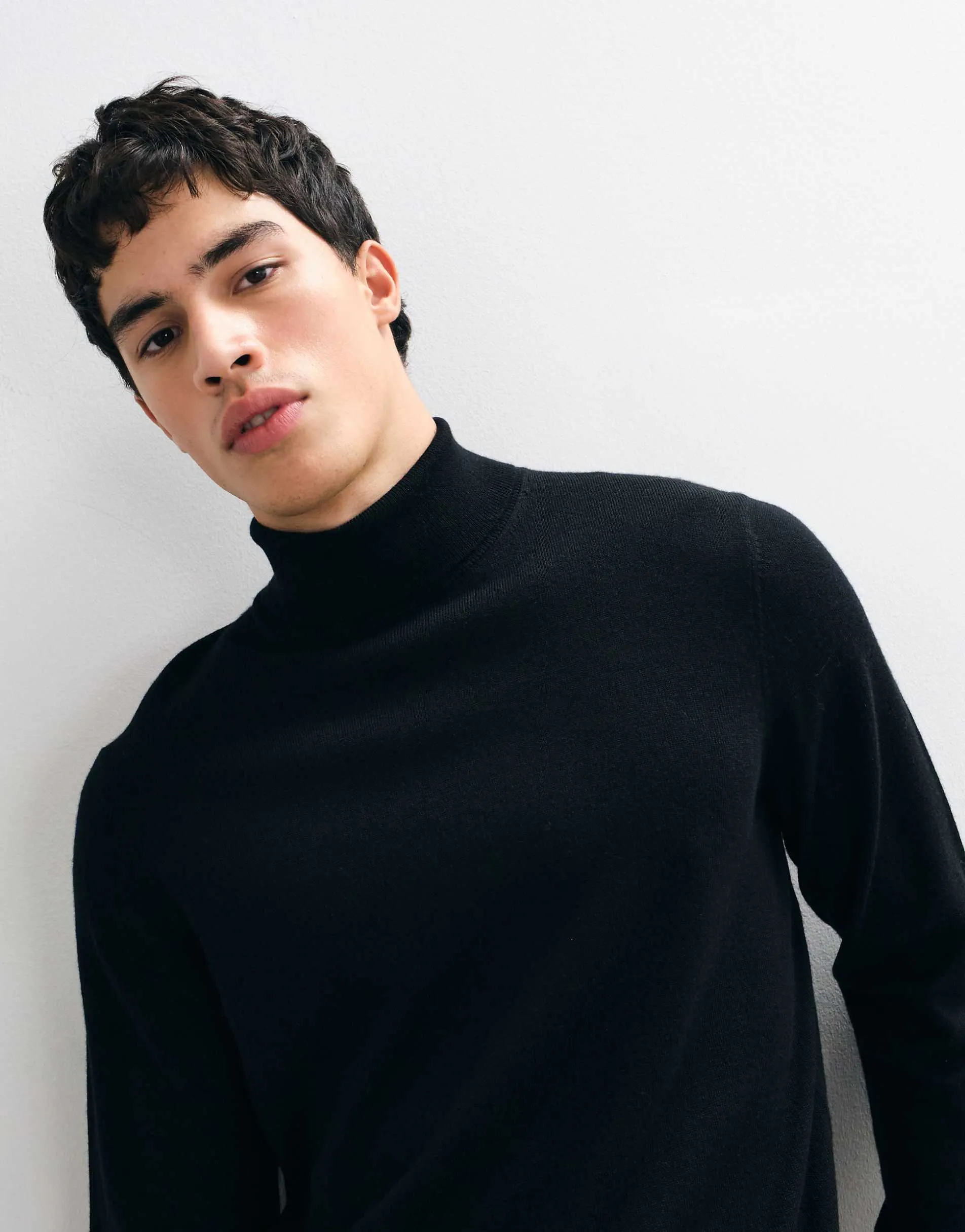 ASOS DESIGN knitted merino wool roll neck in black
