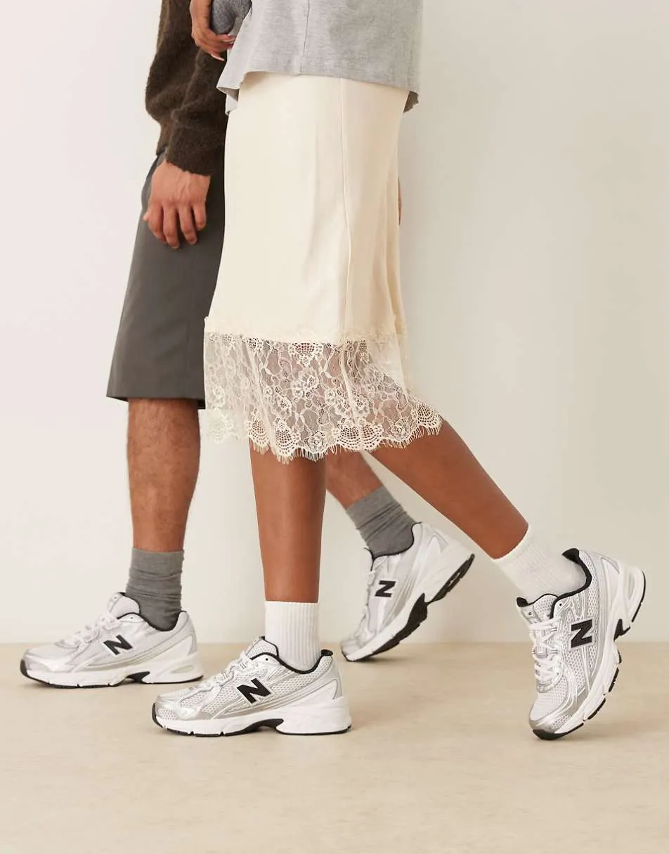 New Balance 740 trainers in white and silver