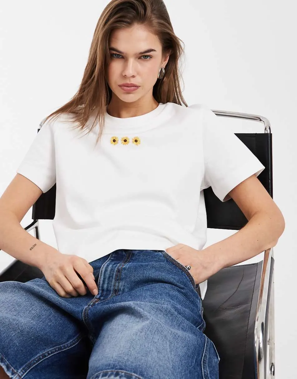 Vero Moda boxy tee with embroidered sunflower graphic in white