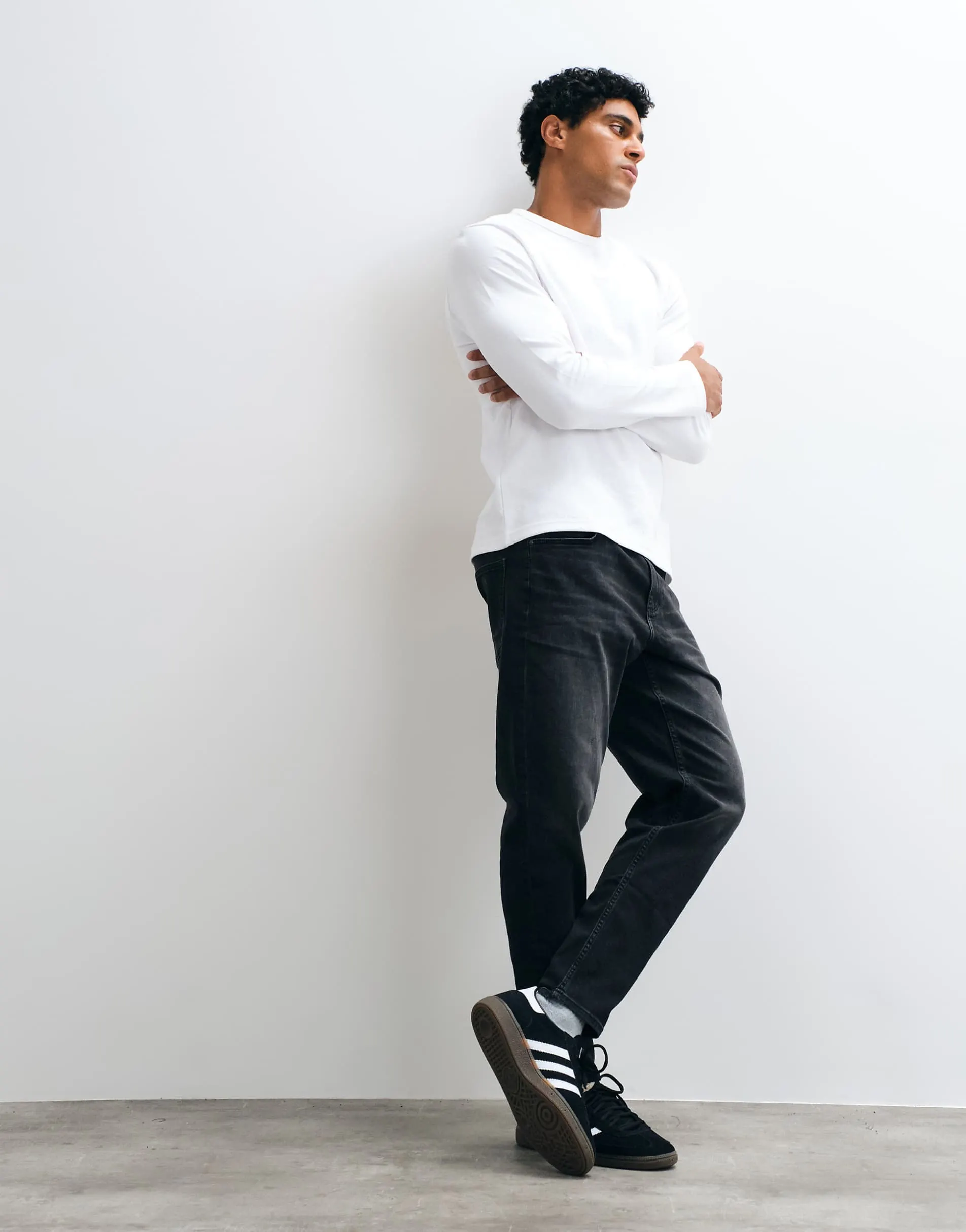 ASOS DESIGN tapered jeans in black wash with stretch