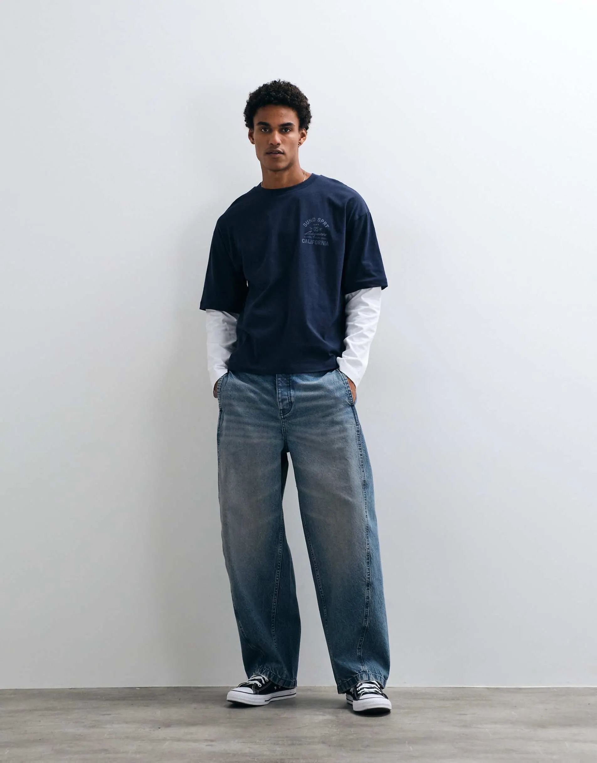 ASOS DESIGN barrel jeans in mid wash blue with stitch detailing