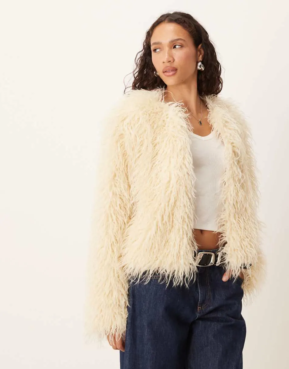 Brave Soul collarless short mongolian faux fur jacket in cream