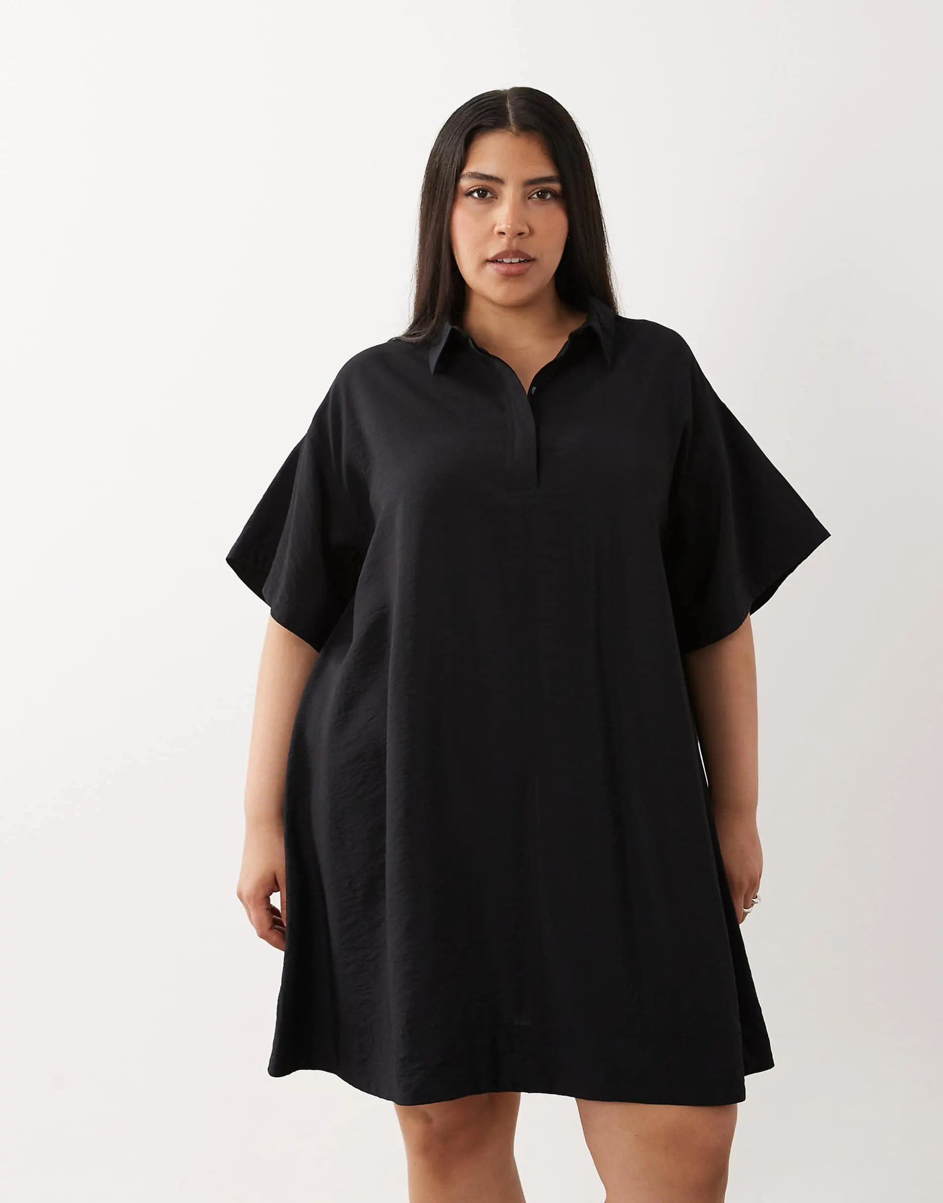 ASOS DESIGN Curve techy fabric relaxed short sleeve mini dress in black