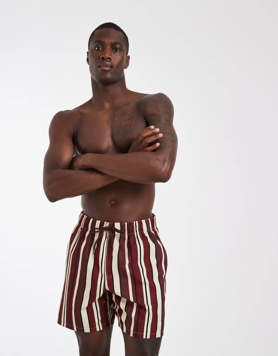 ASOS DESIGN swim shorts in mid length in bold burgundy stripe