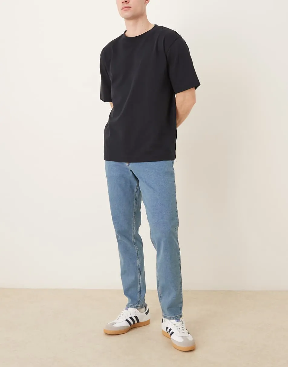 ASOS DESIGN stretch tapered jeans in mid wash blue