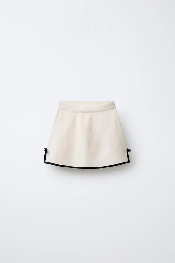 KNIT SKIRT WITH CONTRAST BOWS