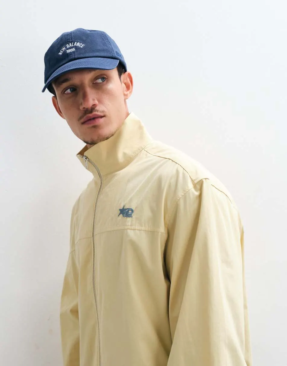 ASOS DESIGN boxy oversized zip through funnel neck jacket with chest embroidery in yellow