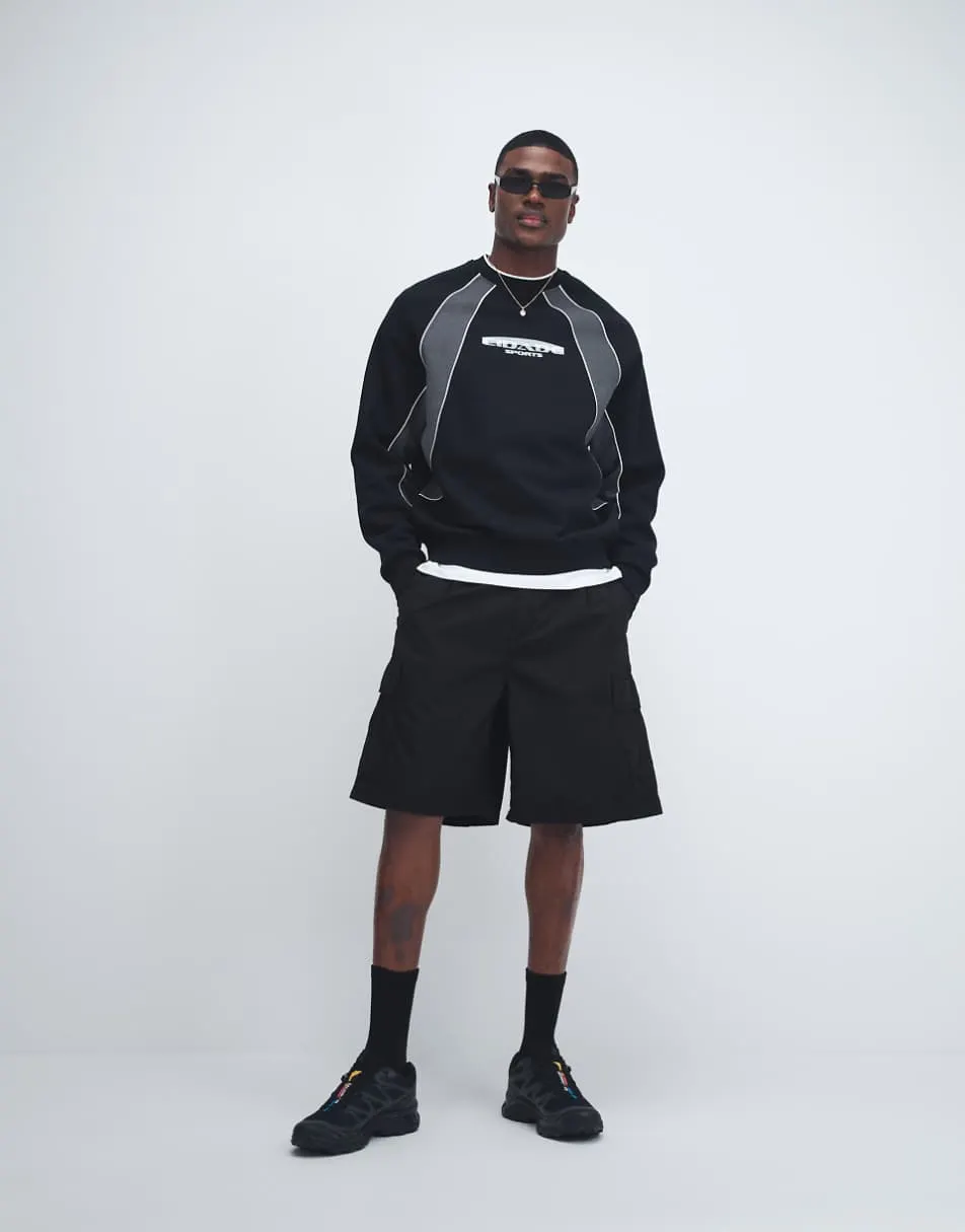ASOS DESIGN relaxed printed sweatshirt with cut & sew panels in black