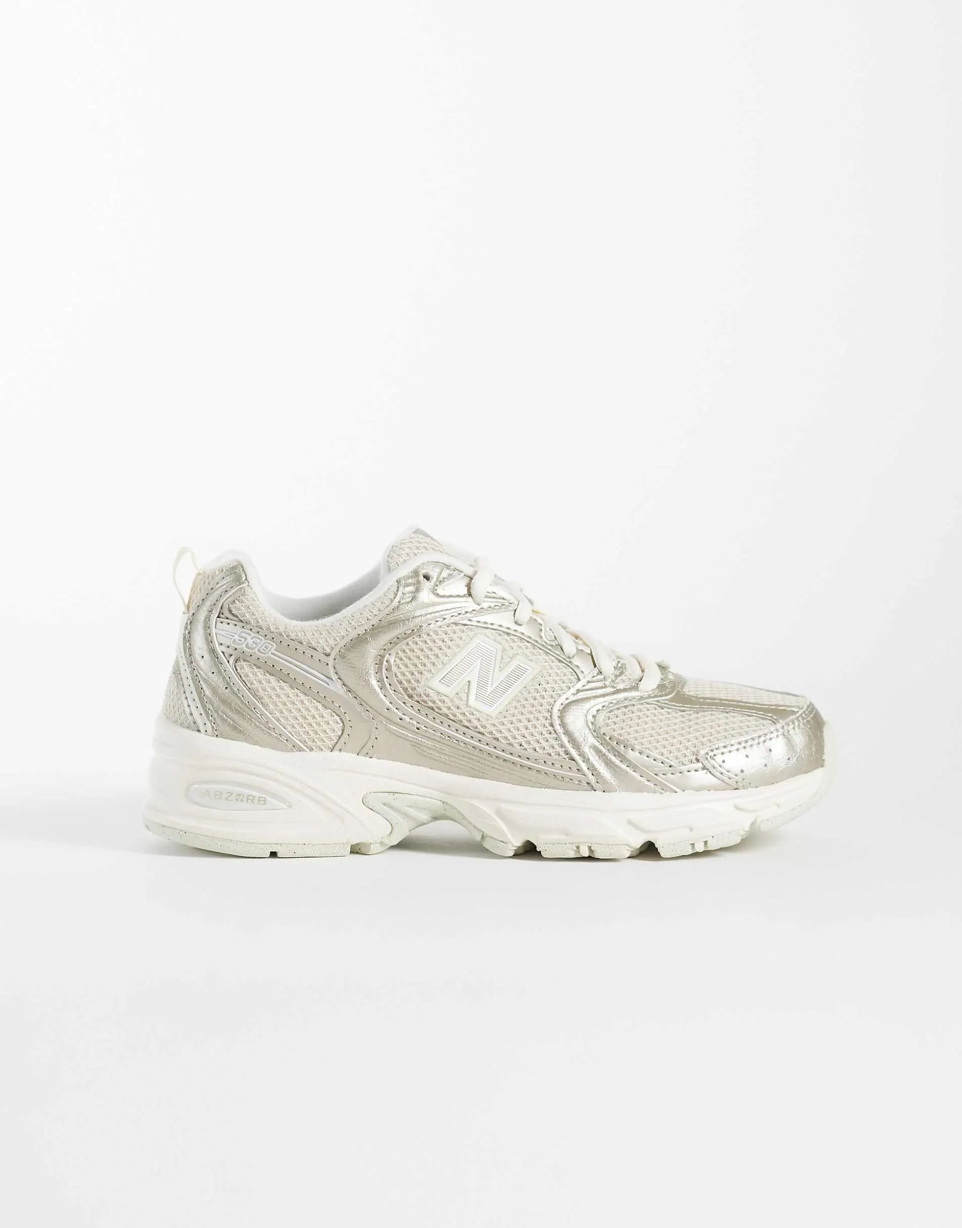 New Balance 530 trainers in gold metallic