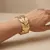 Armband in goudkleurig edelstaal, bladeren