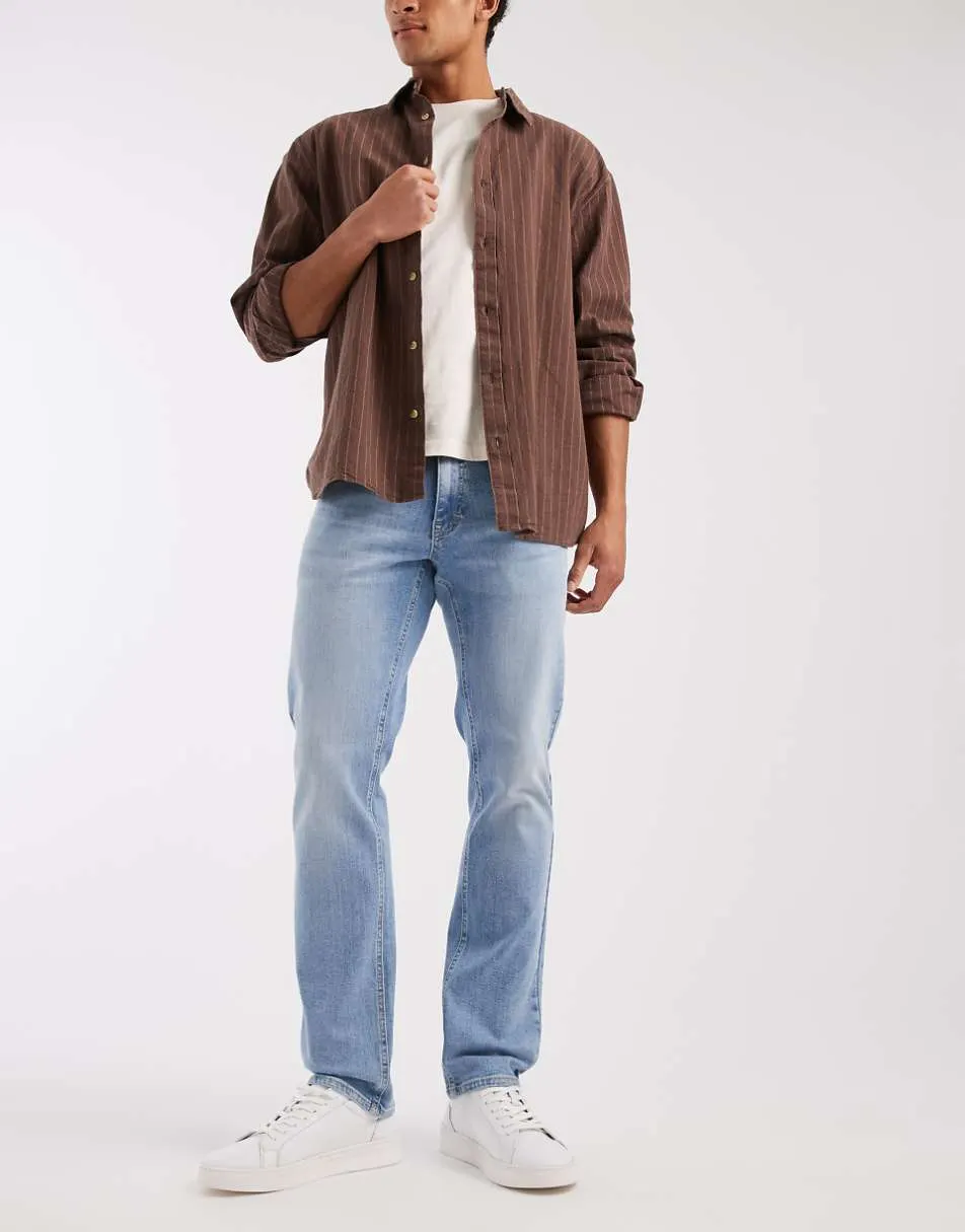 Tommy Jeans scanton slim fit jeans in light wash blue