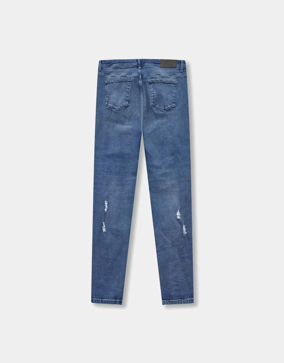 Hera Distressed Slim Fit jean in Mid Blue