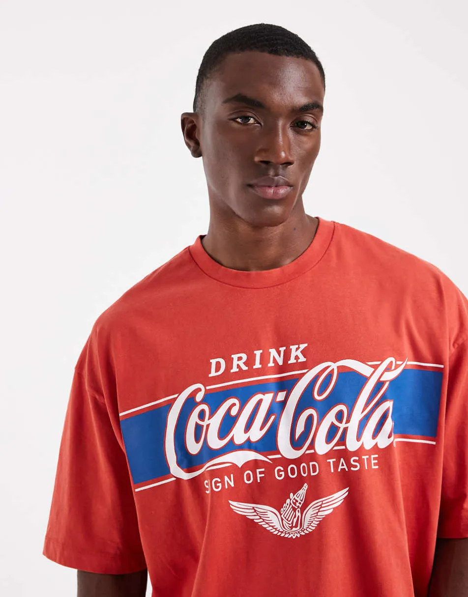 ASOS DESIGN oversized t-shirt with Coca-Cola print in red