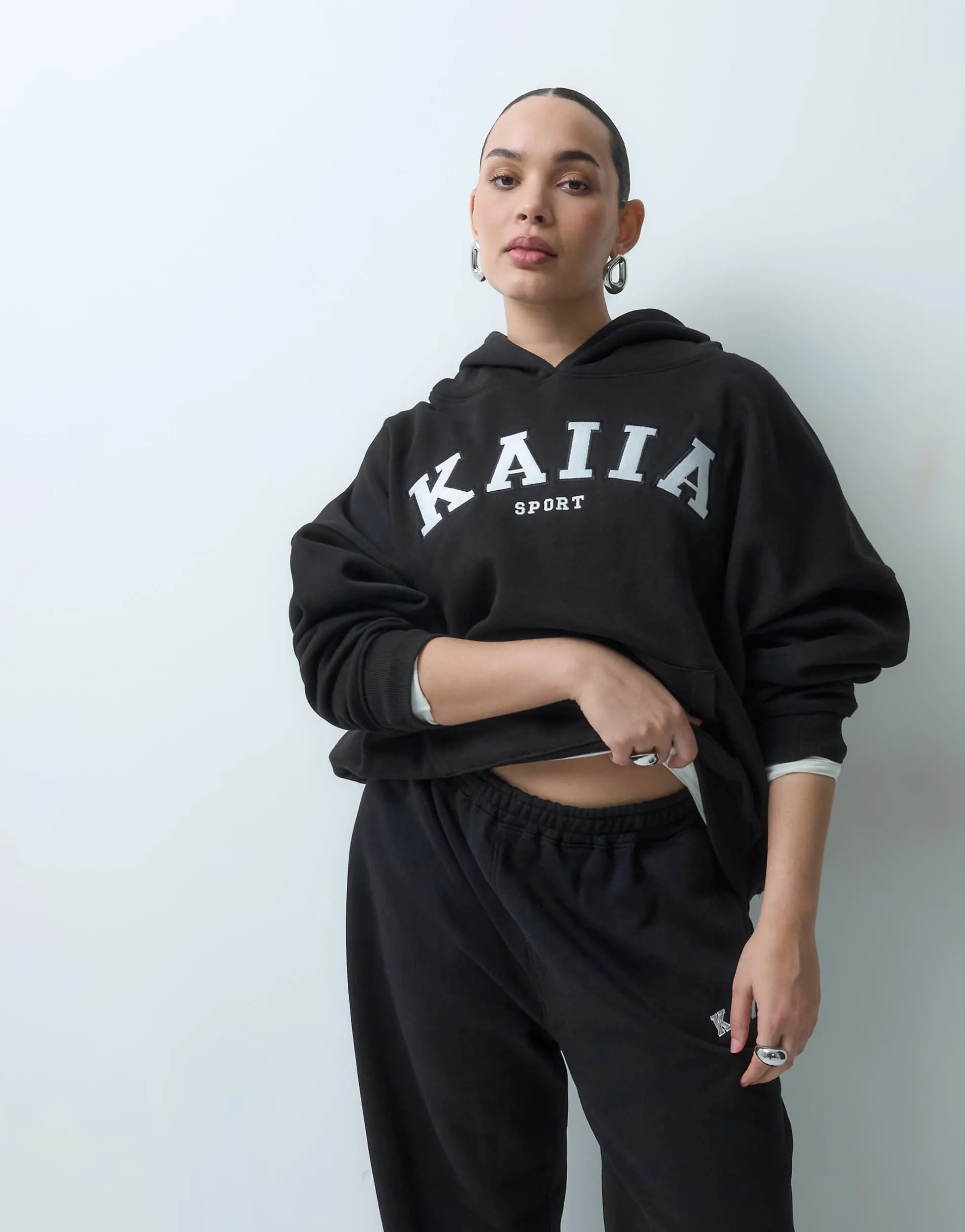 Kaiia Plus cotton blend sport embroidered logo oversized hoodie co-ord in black