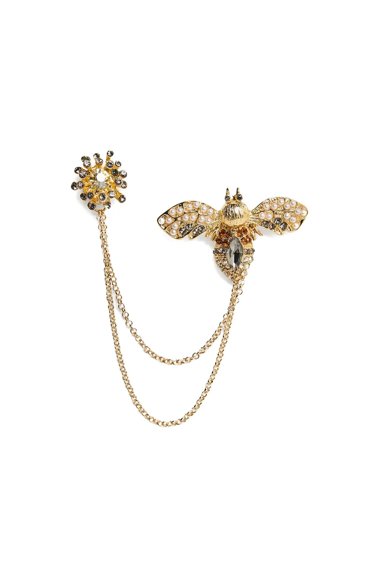 Goudkleurige broche bij