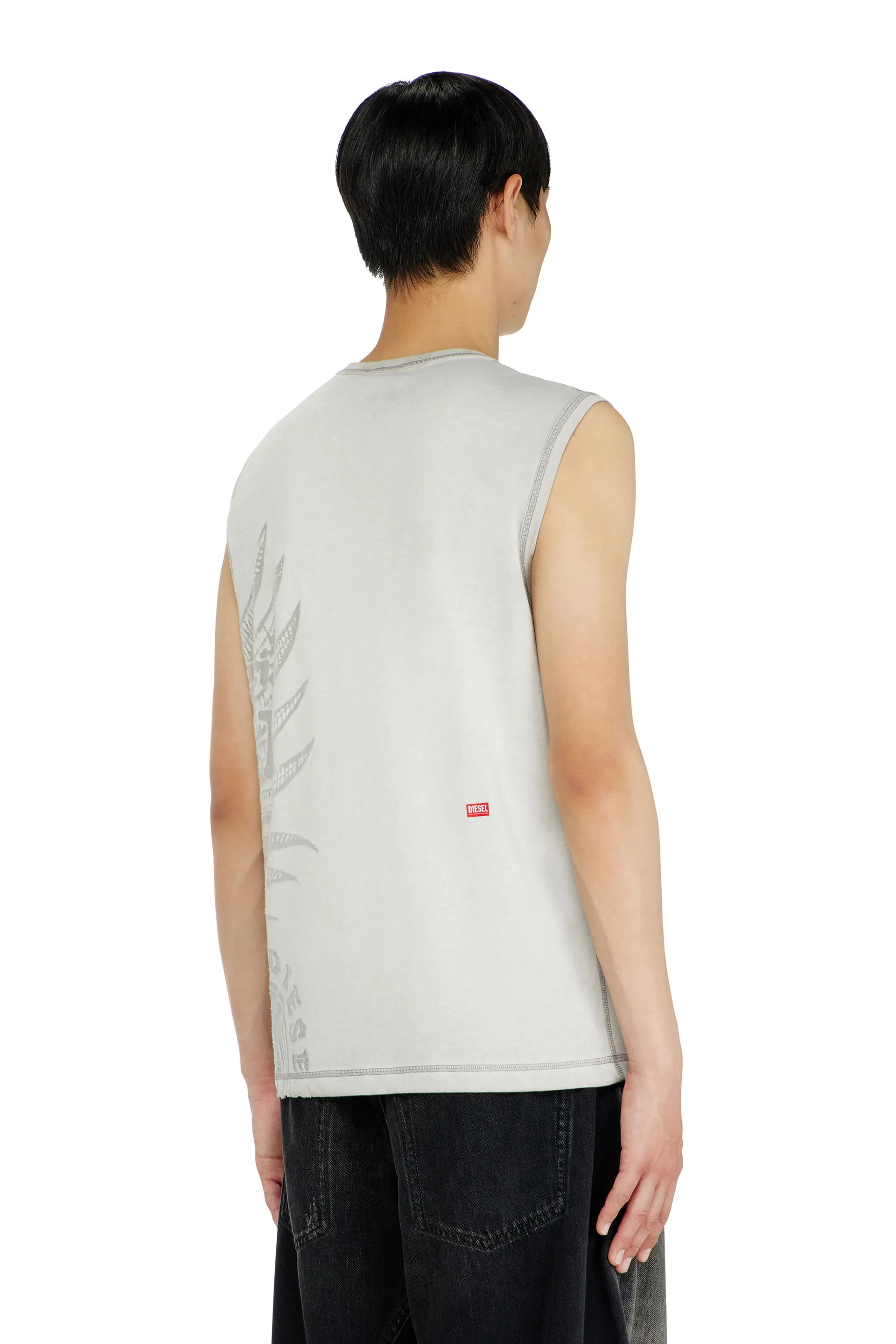 Sleeveless jersey top with embossed graphics