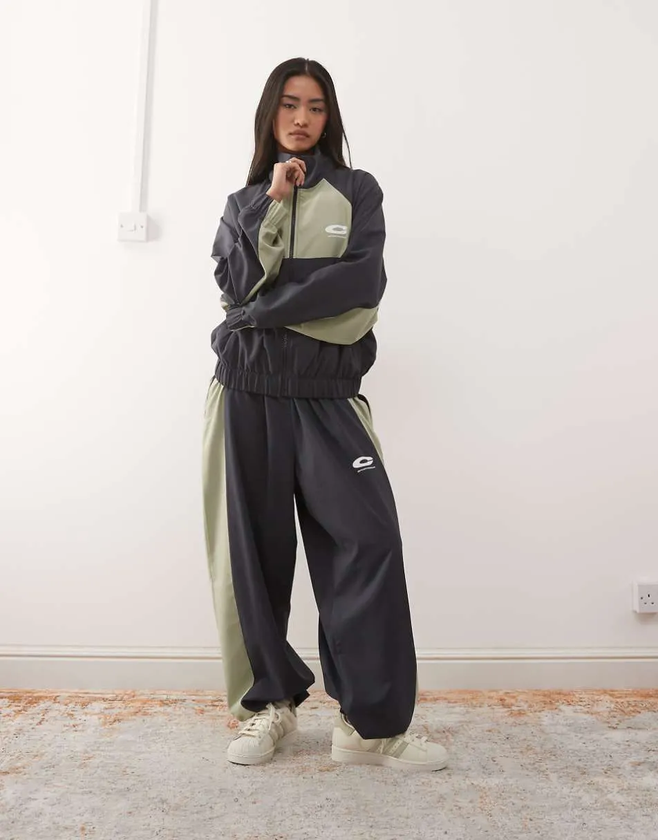 COLLUSION nylon sports jogger co-ord in black and khaki
